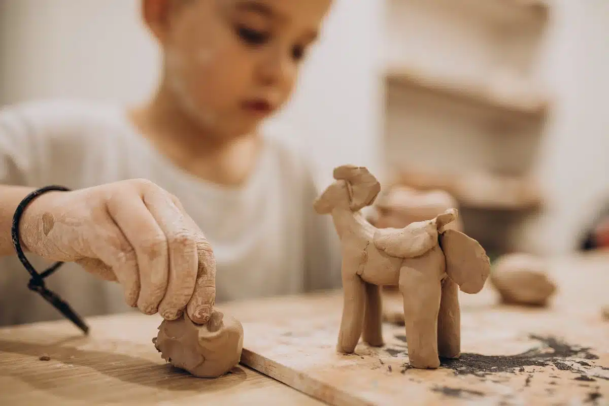 cute-boy-forming-toys-from-clay